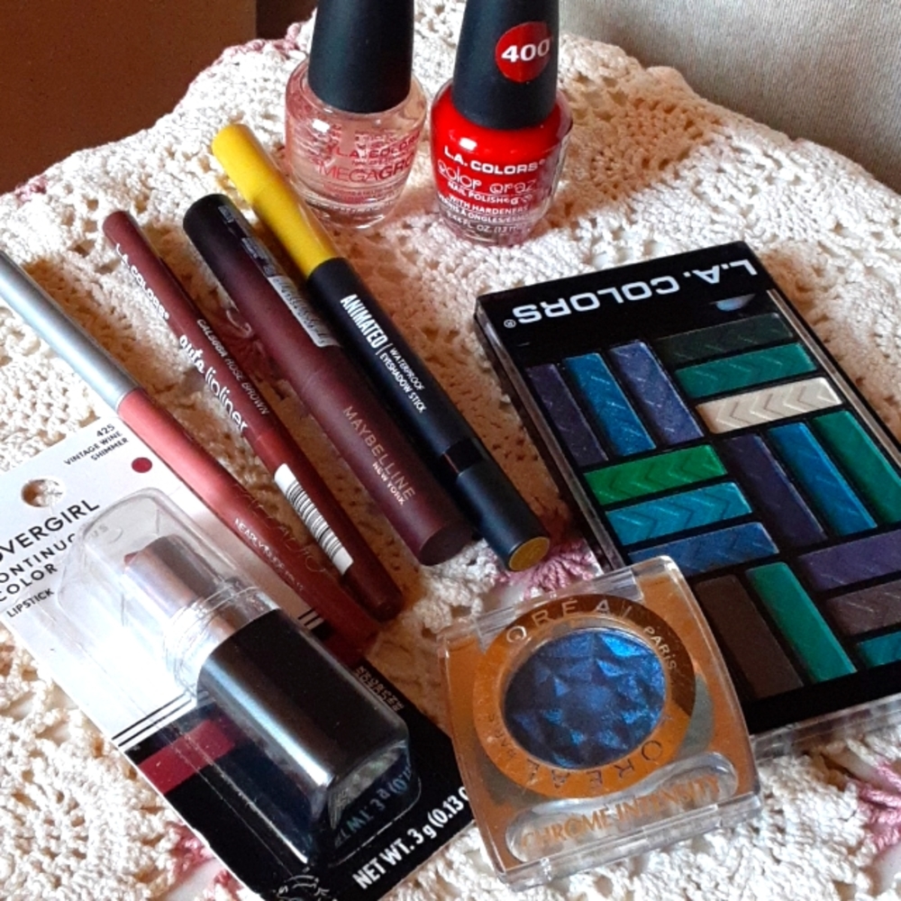SOLD: Assortment of blue eyeshadows, lip sticks, lip liner & nail polish.
